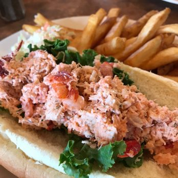 Lobster roll served with a side of fries at the High Tide Café