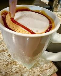 Latte with foam art in a ceramic mug at the High Tide Café