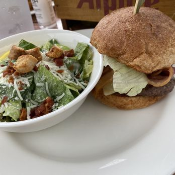 Burger with Caesar salad on the side at the High Tide Café